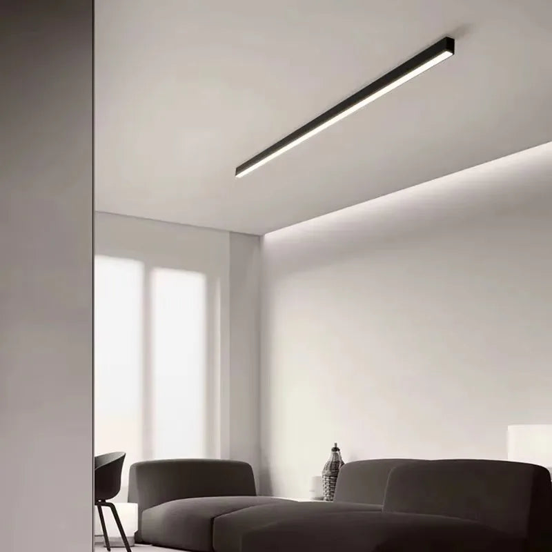 Nowoczesna czarna lampa sufitowa ASCELINA w minimalistycznym salonie z szarą sofą