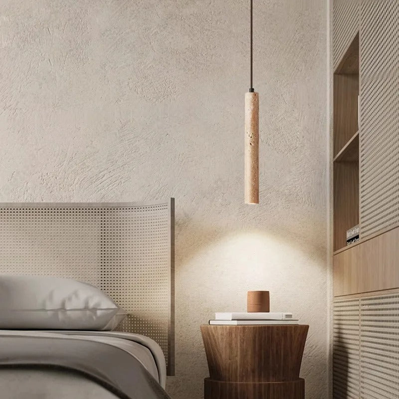 Nowoczesne lampy wiszące w minimalistycznej sypialni nad drewnianym stolikiem nocnym