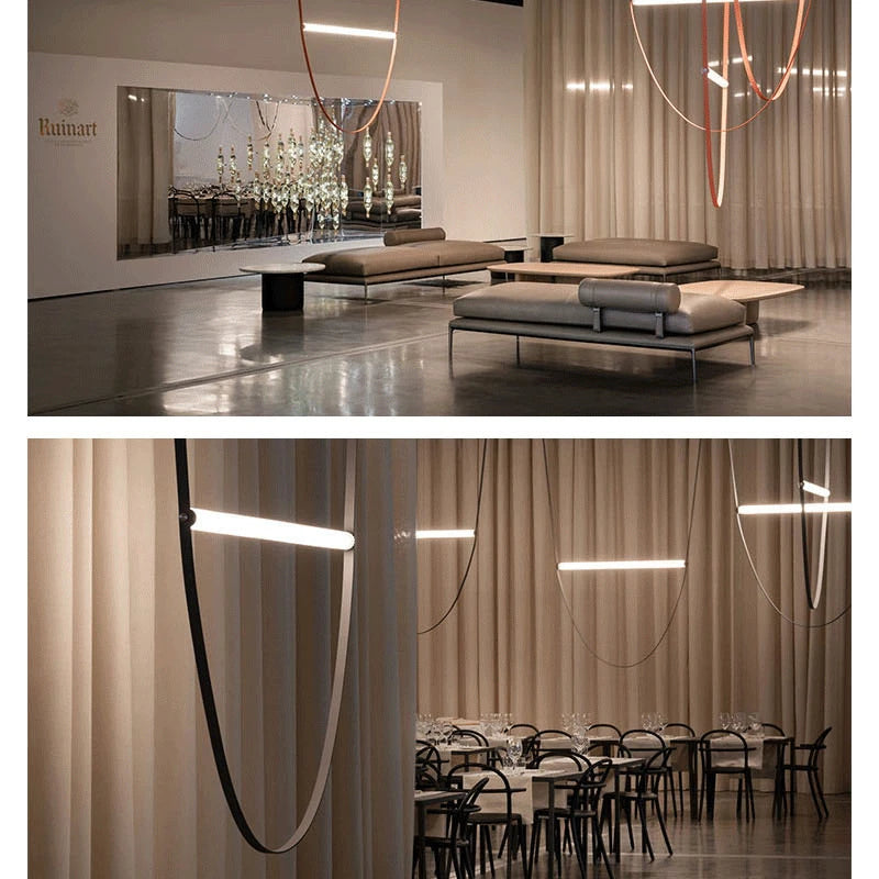 Nowoczesna lampa ze skórzanym paskiem w eleganckim wnętrzu z zasłonami i sofami