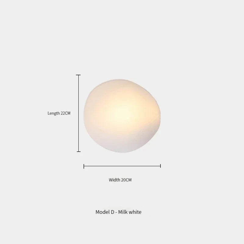 Okrągła mlecznobiała lampa ścienna 22x20 cm emitująca ciepłe światło idealna jako lampy dekoracyjne na ścianę