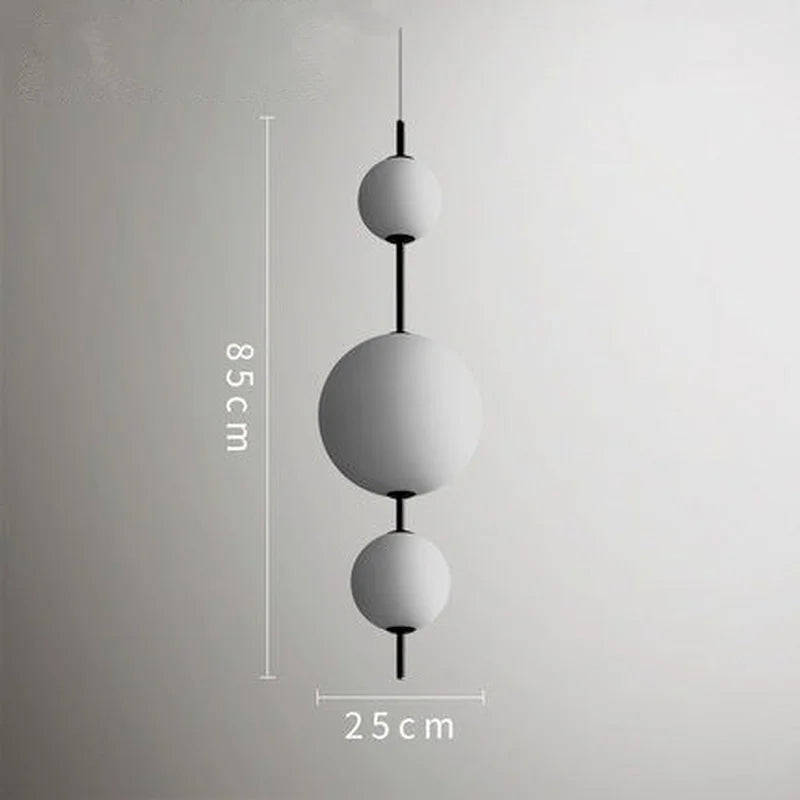 Eleganckie lampy kule wiszące Inna o wysokości 85 cm i szerokości 25 cm w nowoczesnym stylu