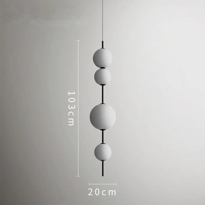 Eleganckie lampy kule wiszące od Inna o wysokości 103 cm i szerokości 20 cm w nowoczesnym stylu