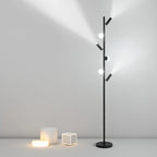 Czarna lampa podłogowa JIANKEXING z trzema kulistymi żarówkami i reflektorami do nowoczesnego wnętrza