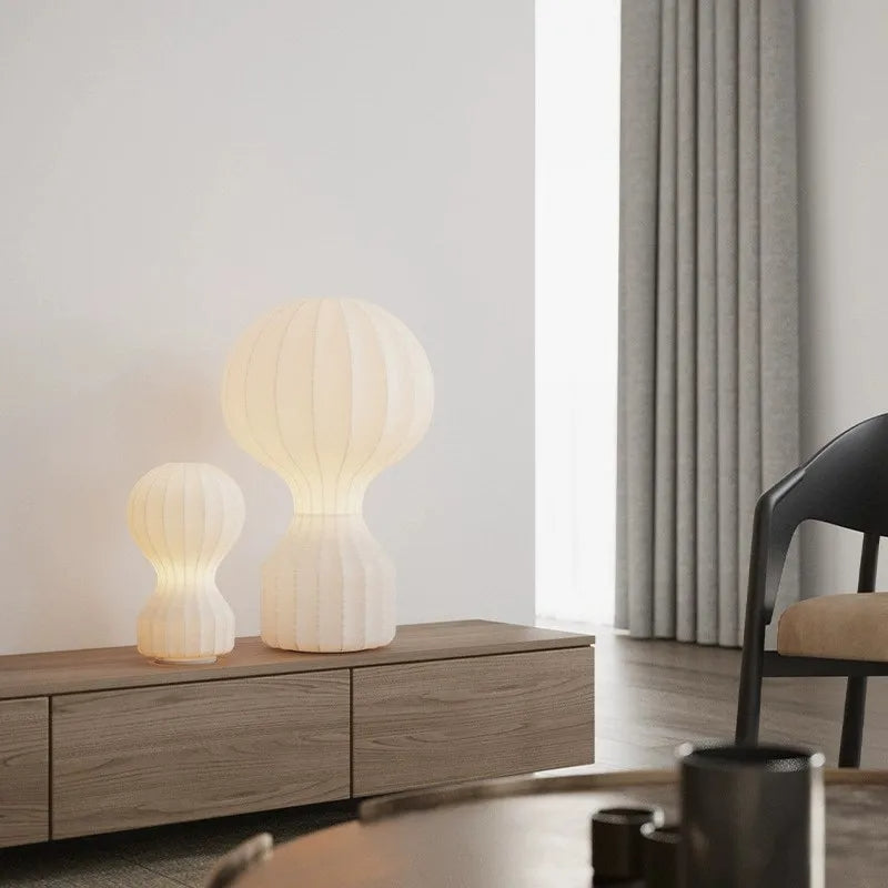 Designerska lampa Barcato w kształcie białej lampy stołowej o nowoczesnym wzornictwie