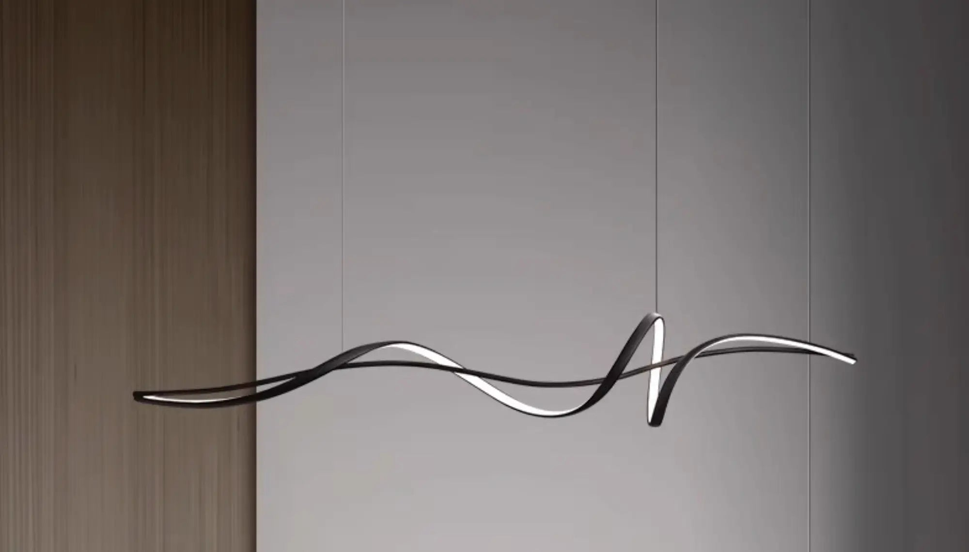Nowoczesne designerskie oświetlenie do jadalni w formie falującej czarnej lampy wiszącej