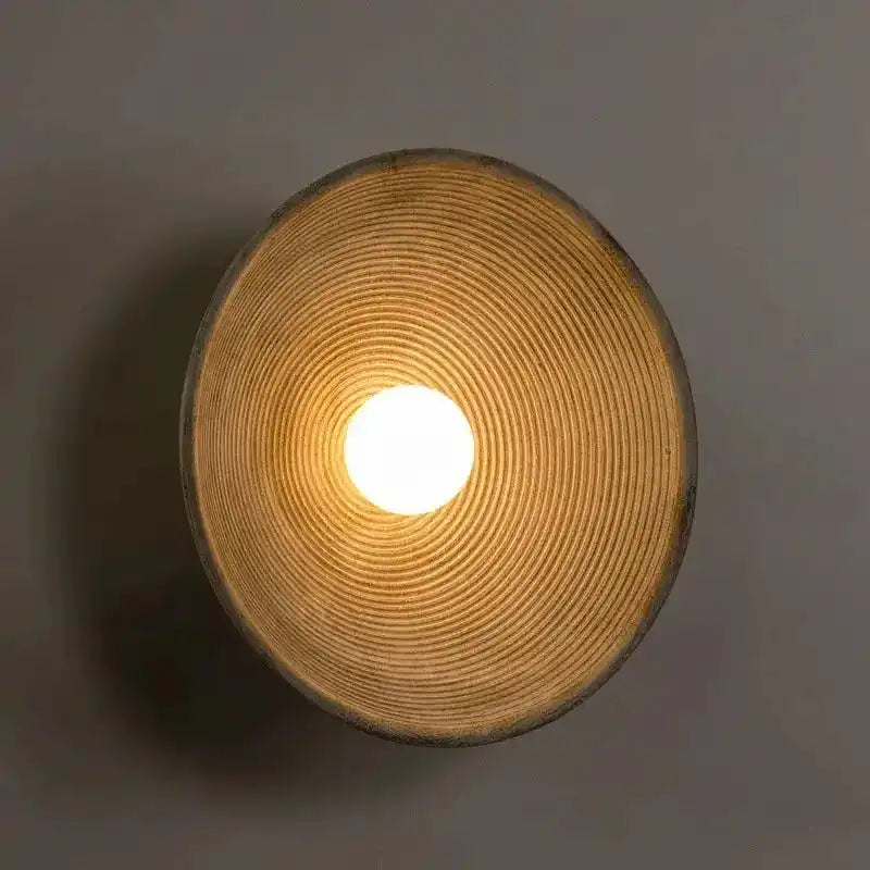 Nowoczesna lampa ścienna QUASHION o unikalnym okrągłym kształcie i ciepłym świetle