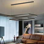 Nowoczesna lampa sufitowa Busmos z trzema geometrycznymi ramami LED w salonie