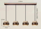 Lampa wisząca z czterema okrągłymi kloszami w stylu nowoczesnym i regulowaną długością zawieszenia