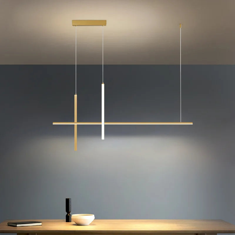 SANDYHA lampa wisząca nowoczesna w złotym kolorze z geometrycznym designem nad stołem