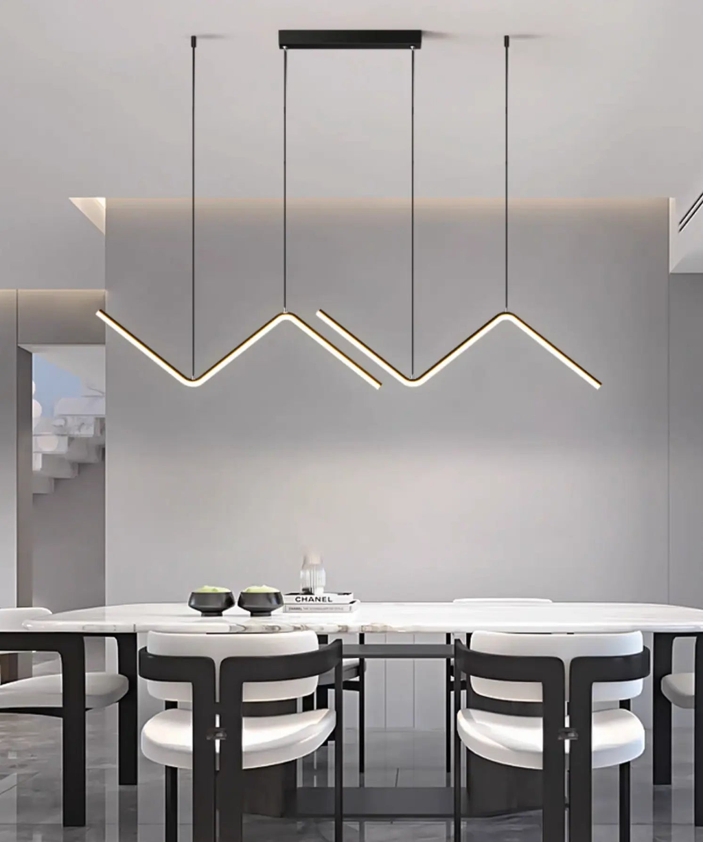 Nowoczesne lampy designerskie do wnętrz wiszące nad stołem w jadalni w stylu minimalistycznym