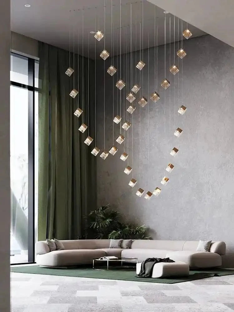 Nowoczesne luksusowe lampy do salonu wiszące nad sofą w eleganckim wnętrzu z dużym oknem
