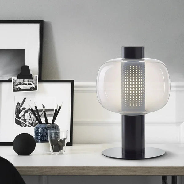 Lampa stołowa Bonvara z przezroczystym kloszem i czarną podstawą na biurku