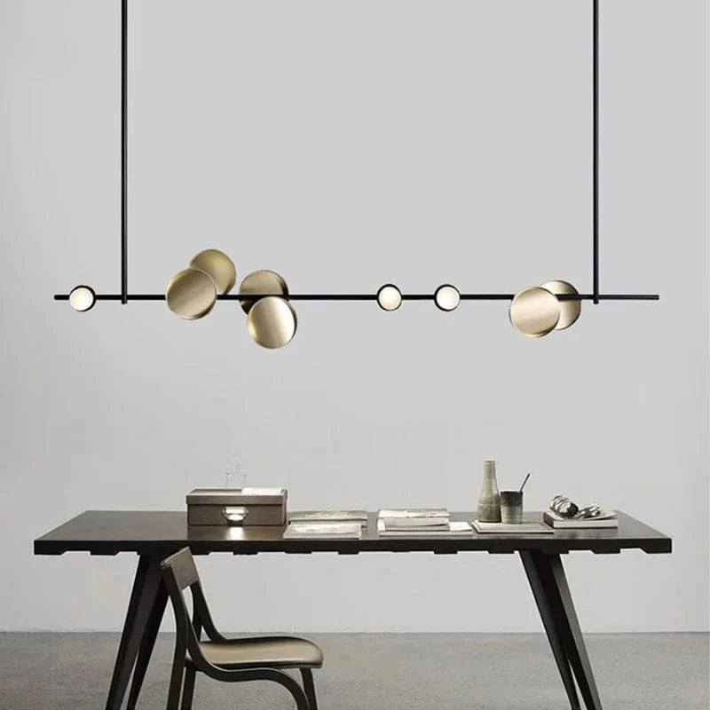 Nowoczesne lampy sufitowe Artpad w stylu minimalistycznym nad stołem do jadalni