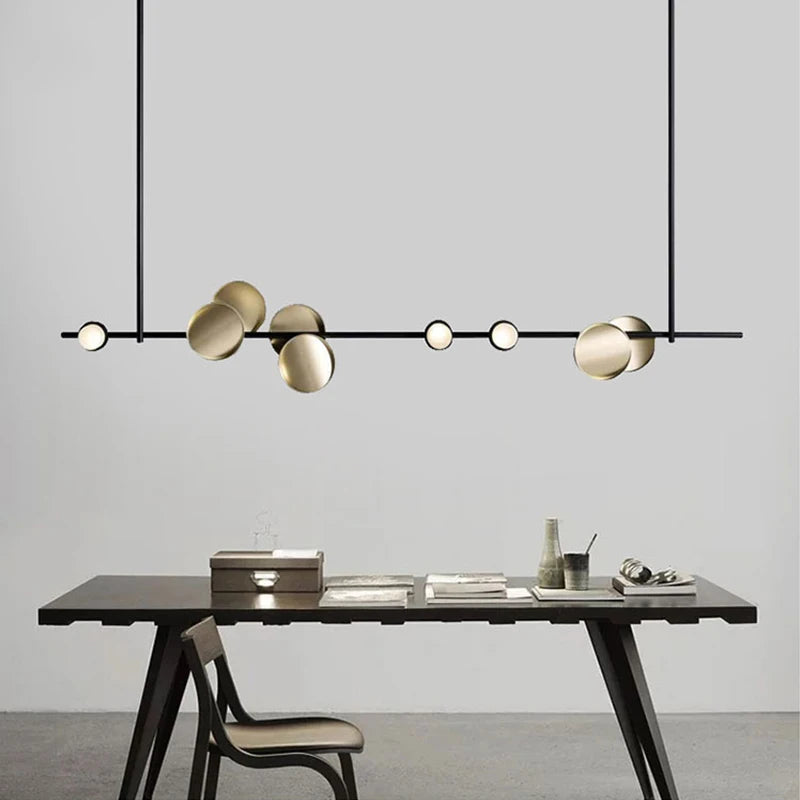 Nowoczesne lampy sufitowe Artpad w stylu minimalistycznym nad stołem do jadalni