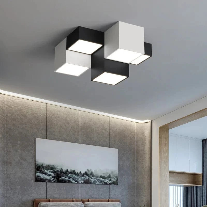 Nowoczesny plafon LED Mavesan z geometrycznym designem w czarno-białym kolorze na suficie salonu