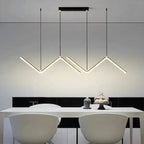 Nowoczesne lampy designerskie do wnętrz marki AODN zawieszone nad białym stołem w jadalni