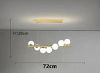 Nowoczesny żyrandol TAONUANSHU z kulistymi białymi kloszami i złotym wykończeniem o wymiarach 72 cm na 120 cm
